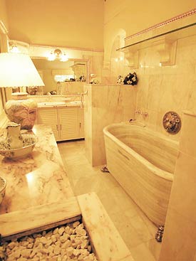 The bathroom features a solid marble bath from Sean Connery's old property at Marbella